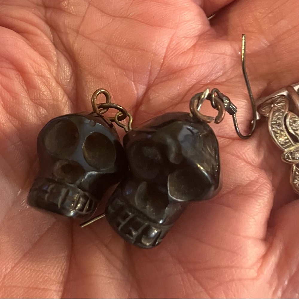 Bakelite Vintage ornately 
 carved pierced earrings, skulls skeleton